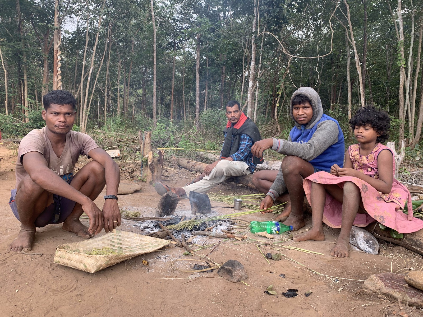 Koyas smoking herbs to prepare medicinal remedy